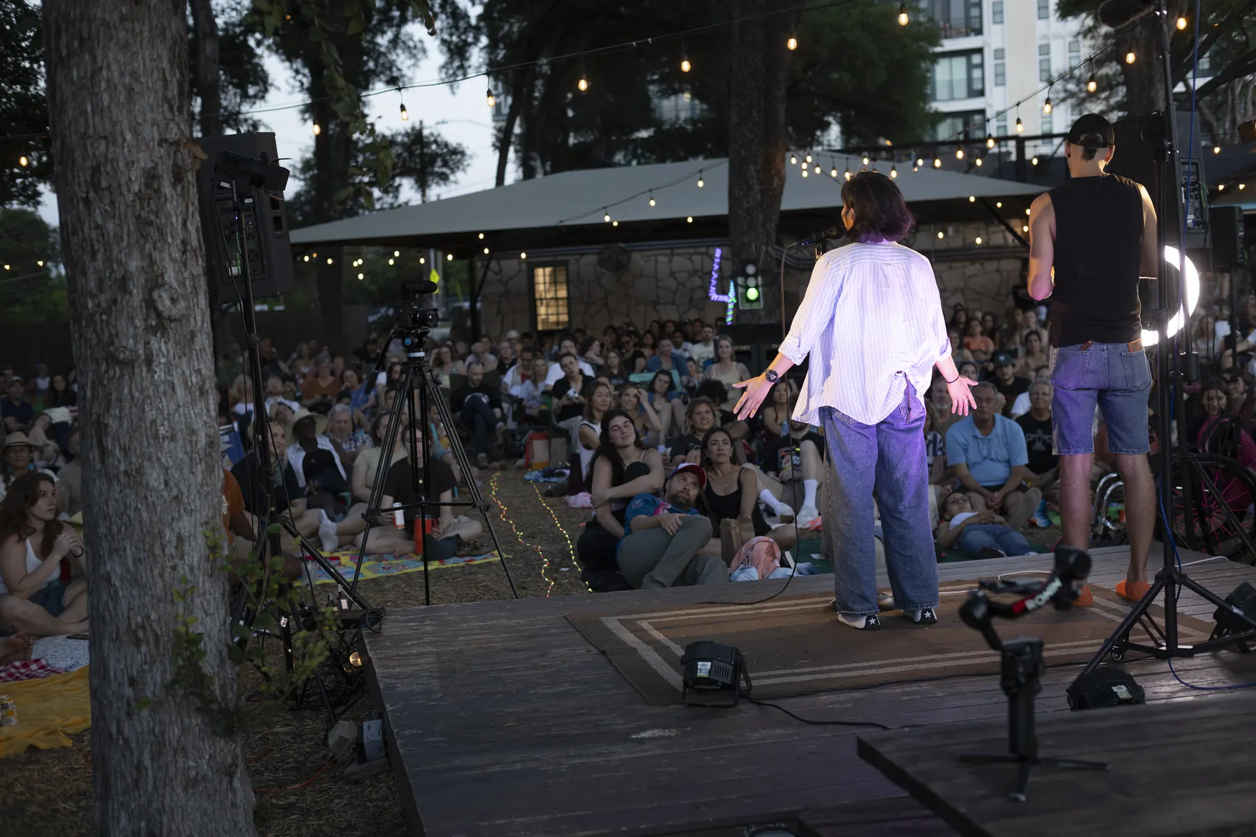 Storytellers on stage in front of a live Hyde Park Storytelling audience